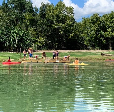 people playing in river